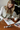 Woman painting with watercolors on a wooden table