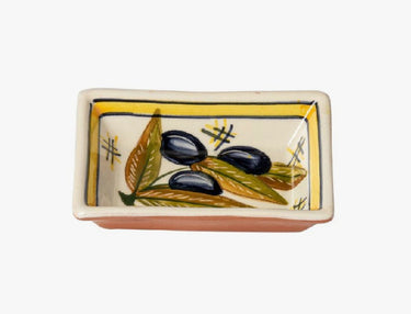 Small Terracotta Dipping Bowl by Casafina featuring black olives and olive leaves against a white background with a yellow border. Underside is terracotta colored.