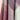 Close-up of fabric swatches in purple, gray, and green on a beige background