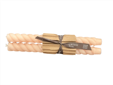 Blush pink colored beeswax taper candle pair with twisted texture
