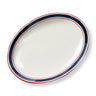 White ceramic platter with blue and red rim on a white background