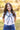 Model wears silk scarf Around shoulders tied in front