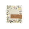 Small notepad featuring a botanical design along the border. 