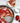 8 Inch Round Cake Pan Shown with strawberry cake. Image features a slice of the cake on a plate, a powdered sugar shaker and some strawberries.