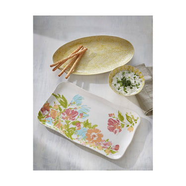 Decorative plates with floral design on a white surface