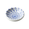 Small white dish with blue decorative patterns on a white background