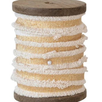 Wooden spool with gold metallic ribbon with cotton fringe edge