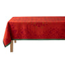 Red floral-patterned tablecloth on a wooden table with a white background