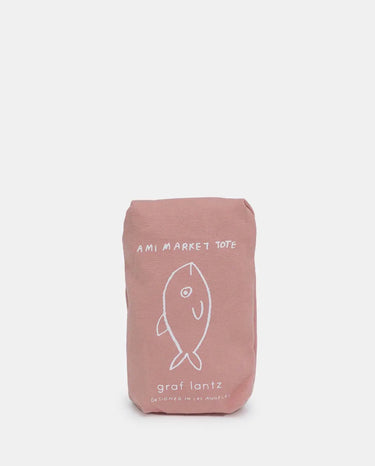 Pink market tote bag with fish design and text on a white background