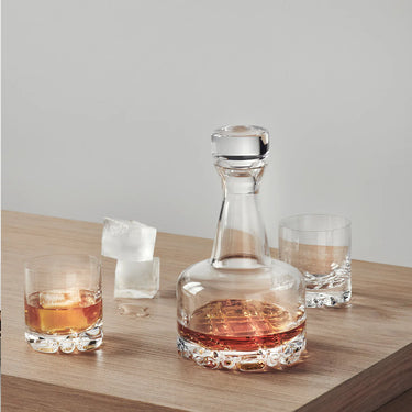 Detail Orrefors Erik Decanter 3 piece set shows with liquor and ice cubes