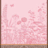 Le Jacquard Francais Blooming Pink Tea Towel. Towel has beautiful floral blooms against a pink background. The borders are an art nouveau scroll design.