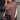 Mersea Frenchie Dolman Neck Top in Espresso. Model has paired it with similar colored pants and a little purse