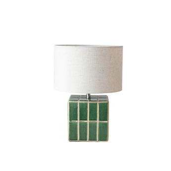 Green ceramic tile lamp with natural linen shade.