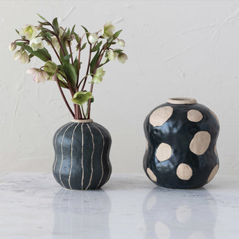 Black organic shaped vase with cream dots
