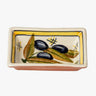 Small Terracotta Dipping Bowl by Casafina featuring black olives and olive leaves against a white background with a yellow border.  Underside is terracotta colored.