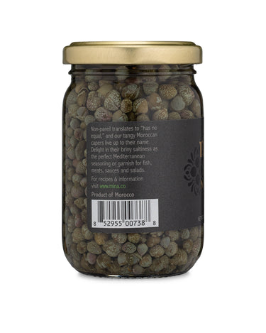 Jar of capers with a gold lid on a white background
