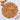 Decorative leaf-shaped placemat on a table with autumn-themed decor.