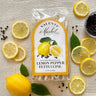 Valente Market lemon pepper fettuccine package with lemons and peppercorns on a textured surface