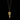 Gold fern leaf necklace on a black background