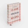 Book titled “Classic French Recipes” by 
Ginette Mathiot. Red and white plaid background. 