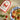 Valente Market fettuccine seasoning package with a bowl of pasta and shrimp on a textured surface