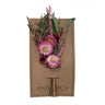 Dried flower bouquet on a brown card with 'ANDUCA' branding