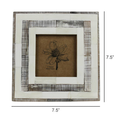 Decorative framed artwork with a floral design on a brown background, featuring dimensions.