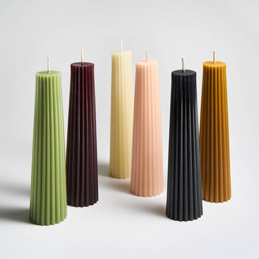 Various colors of Greentree’s 8” Petite Pillar candle